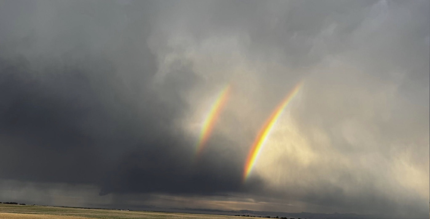 Double rainbow over the plains seen from the road