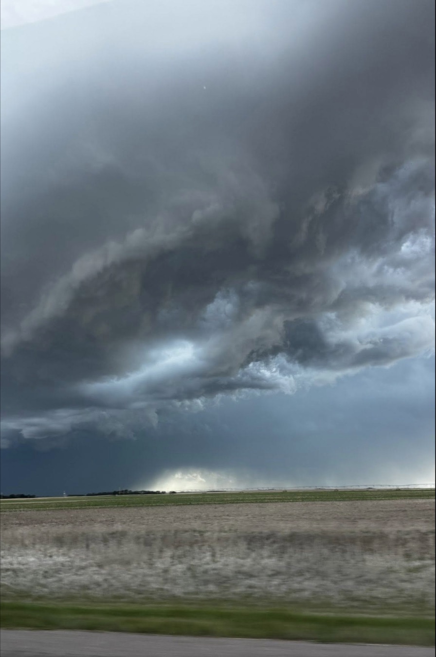 Shelf cloud building over the highway